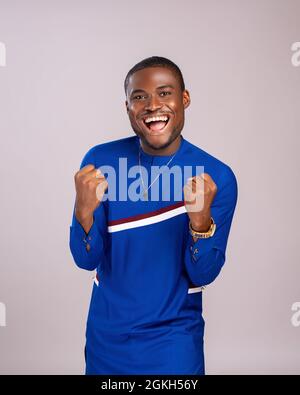 handsome young african man celebrating Stock Photo