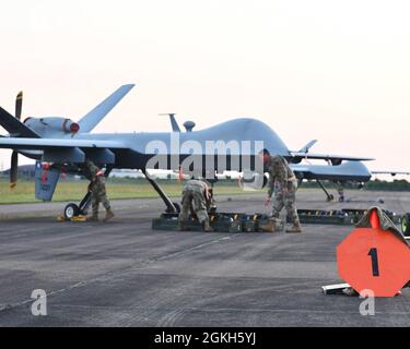 Members of the 147th Attack Wing Maintenance Squadron attach the tail ...