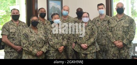 JACKSONVILLE, Fla. (April 22, 2021) - U.S. Navy Surgeon General Rear Adm. Bruce Gillingham meets with Sailors of the Quarter and Sailors of the Year from Naval Hospital Jacksonville and Navy Medicine Readiness and Training Command Jacksonville onboard NAS Jacksonville on April 22. Stock Photo