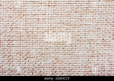 Texture backdrop photo of beige colored knitted flax cloth. Stock Photo