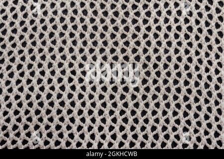 Texture backdrop photo of grey colored knitted net fabric cloth Stock
