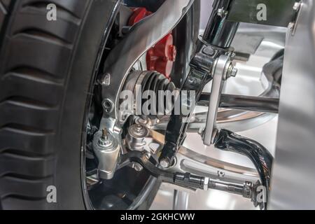 Detailed closeup of the tire and the driving and brake system of an electric car Stock Photo