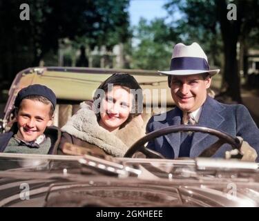 1930s SMILING FAMILY PORTRAIT MAN FATHER WOMAN MOTHER SON BOY RIDING IN CONVERTIBLE AUTOMOBILE ALL LOOKING AT CAMERA - m3736c HAR001 HARS PAIR BEAUTY COLOR RELATIONSHIP CONVERTIBLE OLD TIME NOSTALGIA OLD FASHION AUTO 1 JUVENILE VEHICLE SONS FAMILIES LIFESTYLE SPEED SATISFACTION FEMALES MARRIED SPOUSE HUSBANDS TRANSPORT COPY SPACE LADIES PERSONS AUTOMOBILE MALES ALL CONFIDENCE TRANSPORTATION PARTNER EYE CONTACT HAPPINESS HEAD AND SHOULDERS ADVENTURE LEISURE MOTOR VEHICLE AUTOS EXCITEMENT PROGRESS CLOCHE PRIDE IN MOTORING NECKTIE SUNDAY DRIVE AUTOMOBILES ESCAPE STYLISH VEHICLES JUVENILES Stock Photo