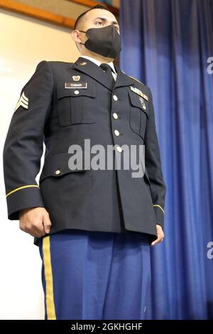 Sgt. Avery Tobar, Headquarters and Headquarters Command, 505th Military Intelligence Brigade, stands at attention as he is named the runner up to the MIRC Non-Commissioned Officer of the Year during an awards ceremony at Joint Base San Antonio – Camp Bullis April 23, 2021, following the conclusion of the MIRC Best Warrior Competition (BWC). During the MIRC BWC Soldiers spend a week competing in a variety of events intended to test their capabilities and combat-readiness, as well as help determine which Soldier will be named the MIRC Best Warrior. Stock Photo