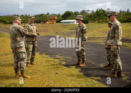 Senior leaders assigned to 3rd Infantry Brigade Combat Team, 25th Infantry Division meet with senior leaders assigned to 1st Battalion, 299th Cavalry Regiment, 29th Infantry Brigade, Hawaii Army National Guard to discuss future training opportunities in the jungle training area at the National Guard installation located in Hilo on Hawaii Island on April 26, 2021. Stock Photo