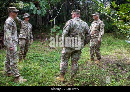 Senior leaders assigned to 3rd Infantry Brigade Combat Team, 25th Infantry Division meet with senior leaders assigned to 1st Battalion, 299th Cavalry Regiment, 29th Infantry Brigade, Hawaii Army National Guard to discuss future training opportunities in the jungle training area at the National Guard installation located in Hilo on Hawaii Island on April 26, 2021. Stock Photo