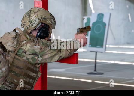 Col. Matthew Jones, 436th Airlift Wing commander, fires an M18 pistol at the Combat Arms Training and Maintenance facility on Dover Air Force Base, Delaware, April 27, 2021. The M18 will replace the M9, which has been in use for more than 30 years. Stock Photo