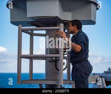 210428-N-NQ285-1009  ATLANTIC OCEAN (April 28, 2021) Interior Communications Electrician 3rd Class John Martinez, assigned to the Harpers Ferry-class dock landing ship USS Carter Hall (LSD 50), performs maintenance on a shipboard antenna, April 28, 2021. Carter Hall is operating in the Atlantic Ocean with Amphibious Squadron 4 and the 24th Marine Expeditionary Unit (24th MEU) as part of the Iwo Jima Amphibious Ready Group. Stock Photo