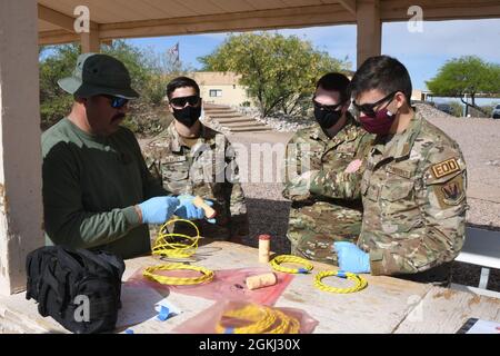 https://l450v.alamy.com/450v/2gkj30x/from-left-officer-joshua-corn-pima-regional-bomb-squad-technician-shows-airman-1st-class-noah-blakley-355th-civil-engineer-squadron-explosive-ordnance-disposal-flight-team-member-u-s-air-force-capt-travis-ellison-355th-ces-eod-flight-commander-and-airman-1st-class-ronald-cataldo-355th-ces-eod-team-member-how-to-prepare-explosives-during-demolition-training-in-tucson-arizona-april-28-2021-the-pima-regional-bomb-squad-provided-a-valuable-opportunity-for-both-sides-to-learn-develop-and-network-by-hosting-the-training-2gkj30x.jpg