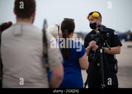 210429-N-OU681-1000 CORPUS CHRISTI, Texas (April 29, 2021) Mass Communication Specialist 2nd Class (AW/SW) Bobby Baldock of the Navy Flight Demonstration Squadron, the Blue Angels, briefs media as the team arrives at Naval Air Station Corpus Christi April 29 ahead of the Wings Over South Texas Air Show scheduled May 1-2. The 2021 show season is Blue Angels' first year flying the Super Hornet platform as well as the 75th anniversary of the team. Stock Photo