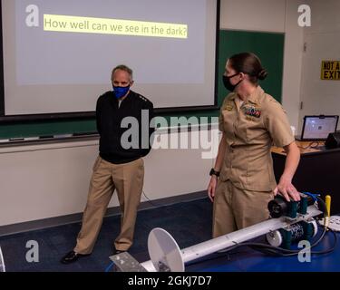 Lt. Cmdr. Shelly Moeller, right, demonstrates the underwater camera used in her research to Vice Adm. Philip Sawyer, Deputy Chief of Naval Operations for Plans and Strategy (N3/N5) during a tour of the NPS Dept. of Oceanography. Sawyer explored some of the university’s interdisciplinary education and research programs relevant to Navy operations and strategy. Stock Photo