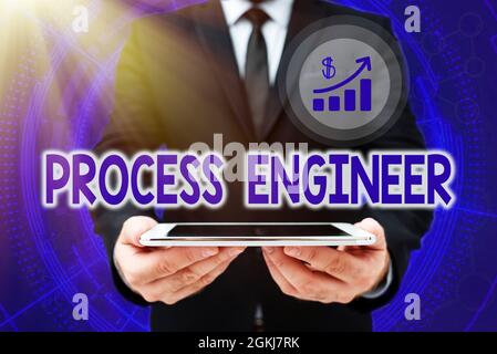 Hand writing sign Process Engineer. Word for responsible for developing new industrial processes Man In Office Uniform Holding Tablet Displaying New Stock Photo