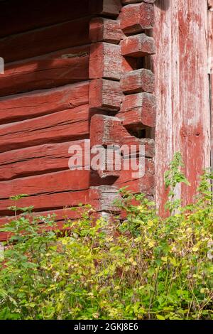 Helsinki / Finland - SEPTEMBER 2, 2021: Close-up detail of an old red log house Stock Photo