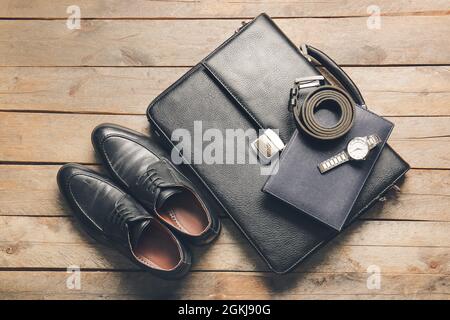 Different stylish male accessories on wooden table Stock Photo