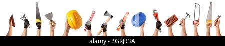 Human hands with construction supplies on white background Stock Photo
