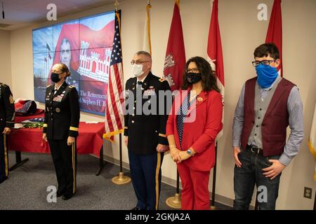 Colonel Stephen Bales is joined by his wife Hope and their son Kaleb, at the front of the room at the U.S. Army Corps of Engineers - Transatlantic Division Headquarters conference room to recieve his medals, certificates, retirement pin and an American flag. COL Bales is retiring after 30 years of service as a U.S. Army Corps of Engineers Officer. He ends his deticated service as the Deputy Commander of the U.S. Army Corps of Engineers - Transatlantic Division, Headquartered in Winchester, Virginia. Stock Photo