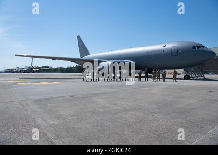 Aircrew and maintainers pose in front of a KC-46A Pegasus with Col. Stephen L. Lanier, 916th Air Refueling Wing Commander, and 916ARW Command Chief Chief Master Sgt. David J. Melby on Seymour Johnson AFB, N.C. on April 30, 2021. The aircraft is the sixth of twelve slated for the wing from Boeing. Stock Photo