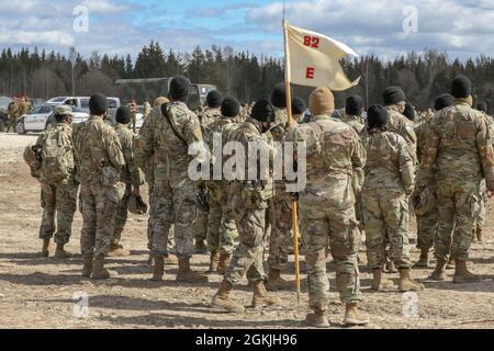 NURMSI, Estonia — U.S. Army Soldiers of Echo Company, 307th Airborne Engineer Battalion, 3rd Brigade Combat Team, 82nd Airborne Division, awaiting further orders for the on ground rehearsal for the Joint Force Entry operation for Swift Response 21, here, May 4, 2021. Swift Response 21 is a linked exercise of DEFENDER-Europe 21 which involves special operations activities, air assaults, and live fire exercises in Estonia, Bulgaria, and Romania, demonstrating airborne interoperability among NATO allies. Stock Photo
