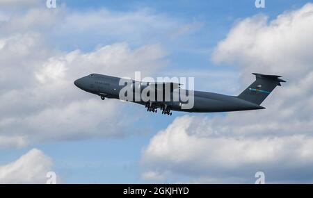 Col. Matthew Jones, 436th Airlift Wing commander, pilots a C-5M Super Galaxy during his fini flight at Dover Air Force Base, Delaware, May 4, 2021. A “fini flight” is an Air Force tradition where an Airman and their family celebrate their final flight. Stock Photo