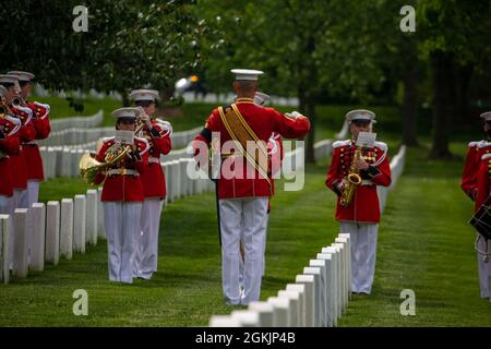 Master Gunnery Sgt. Duane King, drum major, “The President's Own” United States Marine Band, directs Marines during a full honors funeral for Gen. John K. Davis at Arlington National Cemetery, May 6, 2021. General Davis, who served as the 20th Assistant Commandant of the Marine Corps, was born March 14, 1927 and died on July 31, 2019. General Davis was a highly accomplished aviator, flying more than 30 different aircraft throughout his distinguished career. He flew 171 combat missions during the Vietnam War, totaling more than 285 combat hours. He assumed the position as the 20th Assistant Com Stock Photo