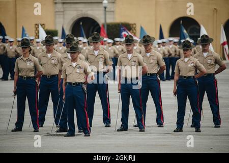 U.S. Marine Corps drill instructors with Lima Company, 3rd Recruit Training Battalion, stand in formation during Lima Company graduation ceremony aboard Marine Corps Recruit Depot San Diego, May 6, 2021. Graduation took place at the completion of the 13-week transformation including training for drill, marksmanship, basic combat skills, and Marine Corps customs and traditions. Stock Photo