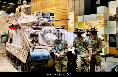 From left to right, Spc. Philip Starkes, Spc. Nicholas Ford and Spc. Tracy Fulton all assigned to Company D, 6th Squadron, 8th Cavalry Regiment, 2nd Armored Brigade Combat Team, 3rd Infantry Division, worked with the National Museum of the U.S. Army on Fort Belvoir, Virginia, to restore the first Bradley Fighting Vehicle to cross into Iraq during Operation Iraqi Freedom to its former glory. The restoration of the Bradley enables modern cavalrymen to connect to their U.S. Army cavalry lineage and maintain the vehicle for future generations. Stock Photo