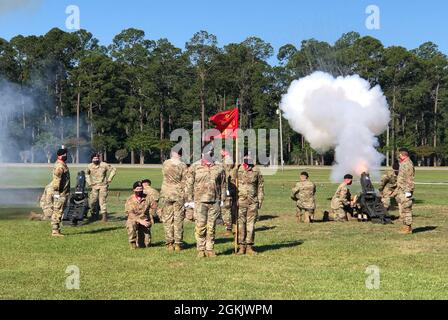 U.S. Soldiers assigned to the Salute Battery of Bravo Battery, 1st Battalion, 9th Field Artillery Regiment, 2nd Armored Brigade Combat Team, 3rd Infantry Division conduct honors during the promotion ceremony of Maj. Gen. Hubert Cottereau on May 7, 2021, on Fort Stewart, Georgia. Cottereau’s role as deputy commanding general is part of the Military Personnel Exchange Program. The program is designed to strengthen bonds of friendship, understanding, and interoperability between the countries and their respective military organizations. Stock Photo