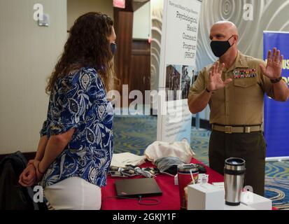 From left to right) Sgt. Maj. Carlos A. Ruiz, sergeant major of Marine  Forces Reserve and Marine Forces South, Rico Alvendia, the captain of the  Legion of Mars, Lt. Gen. David G.