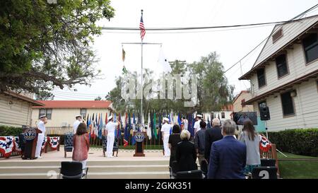 The official party salutes the flag during morning colors at the Naval Health Research Center change of command, May 11. Naval Medical Forces Pacific Commander Rear Adm. Tim Weber presided over the ceremony, during which Capt. William Deniston turned over the helm to Capt. Dennis Faix. Stock Photo