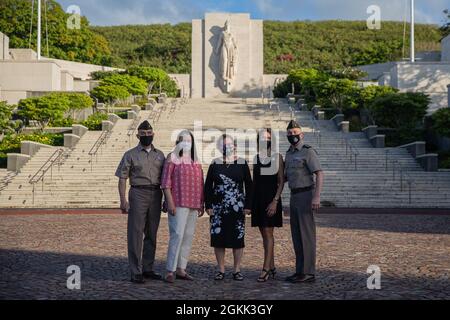 From left to right, Regimental Sgt. Maj. Ralph Martinez, the Chaplain Corps senior enlisted advisor, his spouse Laura Martinez, Natalie Rauch, the memorial’s facilitator, Jill Solhjem, spouse of Maj. Gen. Tom Solhjem, U.S. Army chief of chaplains, and Solhjem poses for a photo at the National Memorial Cemetery of the Pacific May 11 at Punchbowl Crater in Honolulu, Hawaii. Solhjem and Martinez cemetery visit was to honor the memory of the nation’s military veterans and learn about previous chaplains that have sacrificed their lives during the wars. Stock Photo