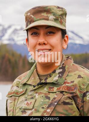 U.S. Air Force Staff Sgt. Michelle Aguilar-Villafuerte, a digital network exploit analyst with the 247th Intelligence Squadron, Tennessee Air National Guard, poses for a portrait while on temporary assignment at Joint Base Elmendorf-Richardson, Alaska, May 12, 2021. Aguilar-Villafuerte was in Alaska to learn new skills and support active-duty operations at JBER. Stock Photo