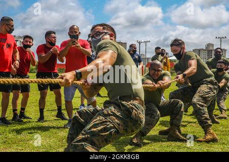 U.S. Marines and families with the 3D Marine Division attend a ...