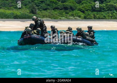 U.S. Marines with India Company, Battalion Landing Team, 3rd Battalion, 5th Marines (BLT 3/5), 31st Marine Expeditionary Unit (MEU), rotate boat teams during an amphibious raid rehearsal at Kin Blue training area, Okinawa, Japan, May 14, 2021. Marines with the 31st MEU conduct raid rehearsals in order to test operational equipment, sustain proficiency in small boat handling fundamentals and refine standard operating procedures. The 31st MEU, the Marine Corps’ only continuously forward-deployed MEU, provides a flexible and lethal force ready to perform a wide range of military operations as the Stock Photo