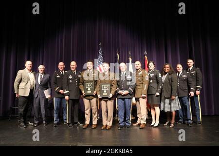 WICHITA, Kan. – The official party, graduates and current and former staff of the Wichita State University Army Reserve Officer Training Corps celebrate the commissioning of the program’s first two Army officers in nearly 30 years May 14. After being disbanded in 1993, the WSU ROTC program was reestablished in the fall of 2019 as the result of a collaboration between Dr. Marché Fleming-Randle, vice president of WSU, and the Kansas Army National Guard. The program’s uniformed cadre and instructors are entirely comprised of KSARNG members, a unique arrangement compared to other ROTC programs, wh Stock Photo