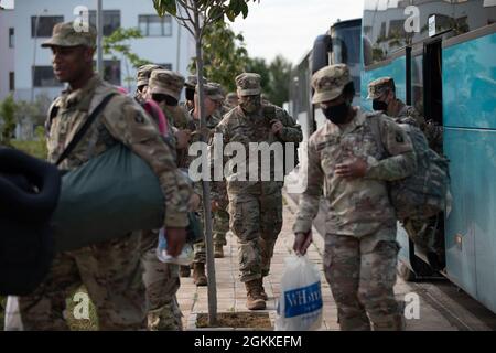 Soldiers from the Florida Army National Guard’s 53rd Infantry Brigade Combat Team arrive in Bathor, Albania May 16, 2021. U.S. Soldiers will be partnering with Albanian Armed Forces during Exercise Immediate Response 21, a logistics-focused exercise to improve the movement of forces and equipment. Immediate Response 21 is part of DEFENDER-Europe 21, a large-scale multinational exercise allowing soldiers to engage with militaries of other nations, learn new skills, and conduct interoperability training. Stock Photo