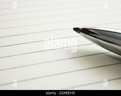 Close up of pen on notebook. Stock Photo