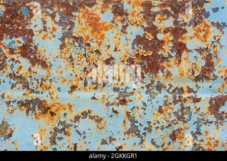 Rust.Old rusty metal background.An old blue metal wall with spots and streaks of rust Stock Photo