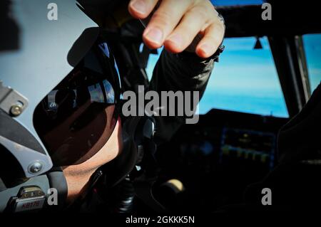 U.S. Air Force Captain 'Joker' looks up at his flight controls during mission checks in a B-52H Stratofortress operating out of Morón Air Base, Spain, on May 19, 2021. Bomber Task Force missions allow aircrew to gain experience operating in new theaters. Stock Photo