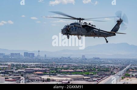 An HH-60G Pave Hawk assigned to the 34th Weapons Squadron flies over North Las Vegas, Nevada, May 18, 2021. The competition incorporated multiple units and career fields and allowed instructors at the U.S. Air Force Weapons School the chance to demonstrate tactical procedures.