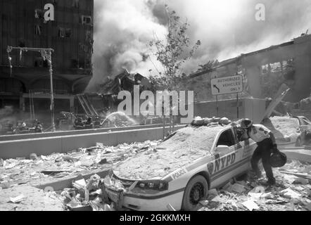 NYPD and FDNY first responders in New York City as theTwin Towers burn during the terrorist attack on September 11, 2001. (USA) Stock Photo