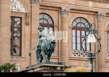 Lion statue in front of the Theater Massimo Vittorio Emanuele in Palermo, Sicily Stock Photo