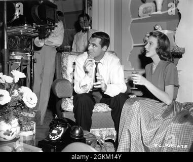 CARY GRANT and DIANA LYNN on set candid with Movie / Camera Crew during filming of EVERY GIRL SHOULD BE MARRIED 1948 director DON HARTMAN costumes Irene Sharaff RKO Radio Pictures Stock Photo