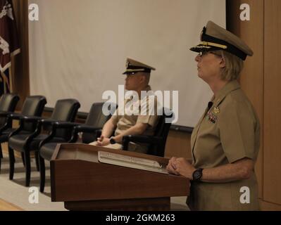 Cmdr. Linda Smith, Naval Medical Research Unit San Antonio (NAMRU-SA) executive officer and change of command emcee, stands by for the arrival of the official party, May 21. During the ceremony, NAMRU-SA welcomed incoming Commanding Officer Capt. Gerald DeLong and bid farewell to Capt. Andrew Vaughn during a change of command ceremony Guest speaker was Naval Medical Forces Pacific Commander Rear Adm. Tim Weber who has oversight of Navy Medicine's eight research labs, including NAMRU-SA. Stock Photo