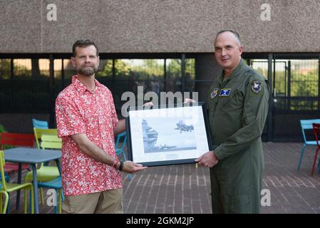 Lt. Gen. Eric Fick, F-35 Joint Program Executive Officer, and Brett Matthews, F-35 Chief of Staff, poses for a photo mat during Mr. Matthews's farewell reception at the program headquarters in Arlington, Va. The F-35 Joint Program Office is the Department of Defense's focal point for the 5th generation strike aircraft for the Navy, Air Force, Marines, and our allies. The F-35 is the premier multi-mission, 5th generation weapon system. Its ability to collect, analyze and share data is a force multiplier that enhances all assets in the battle-space: with stealth technology, advanced sensors, wea Stock Photo