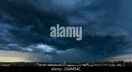 Incoming thunderstorm on a summer evening over Augsburg Stock Photo