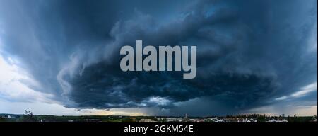 Incoming thunderstorm on a summer evening over Augsburg Stock Photo