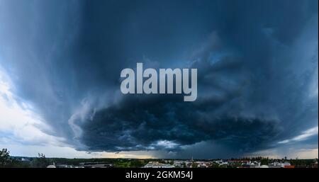 Incoming thunderstorm on a summer evening over Augsburg Stock Photo