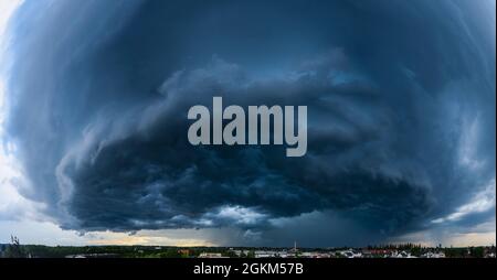 Incoming thunderstorm on a summer evening over Augsburg Stock Photo