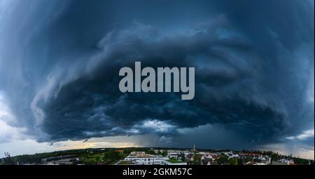 Incoming thunderstorm on a summer evening over Augsburg Stock Photo