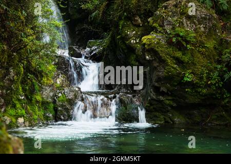 Avalanche Creek Waterfall in the rain, Arthur’s Pass, South Island, New Zealand. Stock Photo